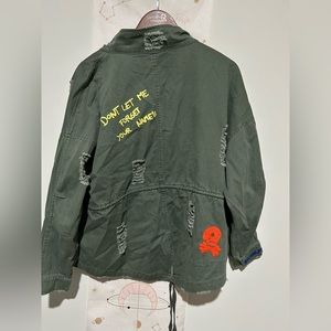 Embroidered, ripped military jacket